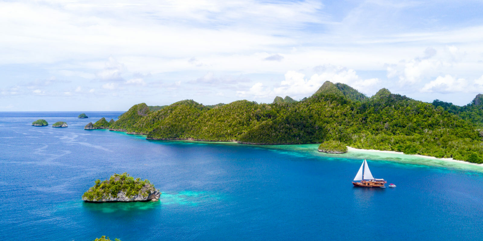 Phinisi Cruise Sailing Across Raja Ampat | Hello Papua